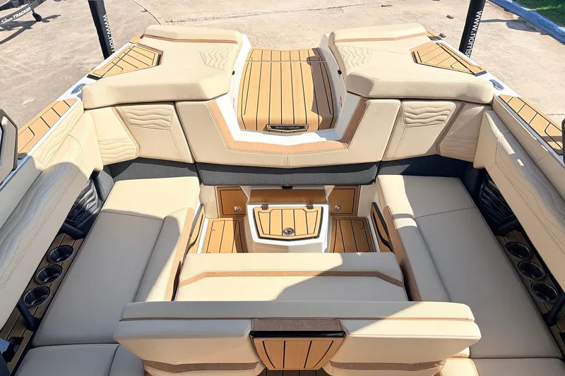 Slide: The Image of Luxurious interior of 2026 Nautique Super Air Nautique G23 boat with beige seating. - 39