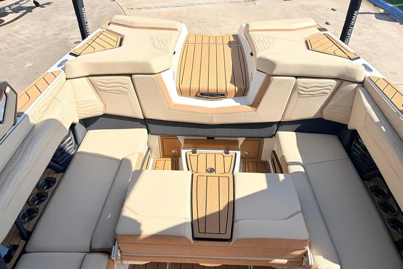 Slide: The Image of Luxurious interior of 2026 Nautique Super Air Nautique G23 boat with tan seating. - 38
