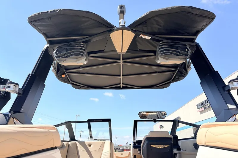 Slide: The Image of 2026 Nautique Super Air Nautique G23 boat interior with speakers and canopy. - 68