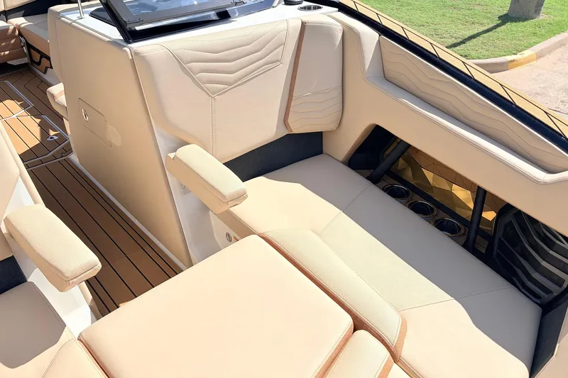 Slide: The Image of Luxurious interior of 2026 Nautique Super Air Nautique G23 boat with beige seating. - 19