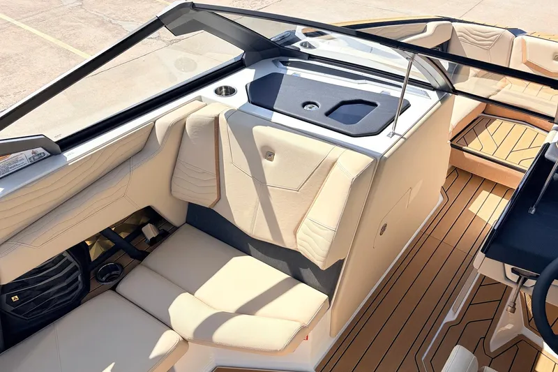 Slide: The Image of 2026 Nautique Super Air Nautique G23 interior with beige seating and sleek design. - 28