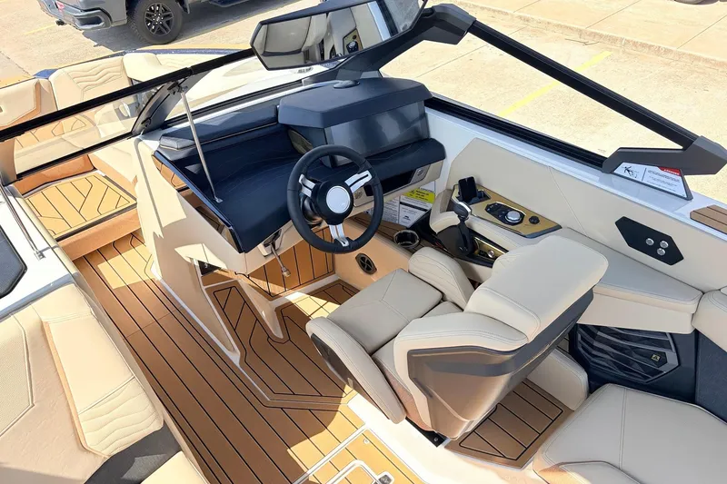 Slide: The Image of 2026 Nautique Super Air Nautique G23 interior with luxurious seating and modern dashboard design. - 48