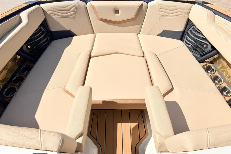 Slide: The Image of Luxurious seating area of 2026 Nautique Super Air Nautique G23 boat. - 16