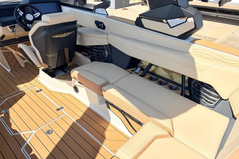 Slide: The Image of Interior of 2026 Nautique Super Air Nautique G23 with luxurious seating and modern design. - 46