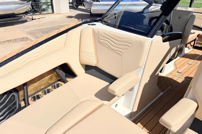 Slide: The Image of 2026 Nautique Super Air Nautique G23 interior with beige seating and modern design. - 18