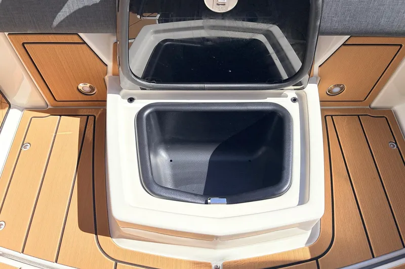 Slide: The Image of Storage compartment on 2026 Nautique Super Air Nautique G23 boat deck. - 43