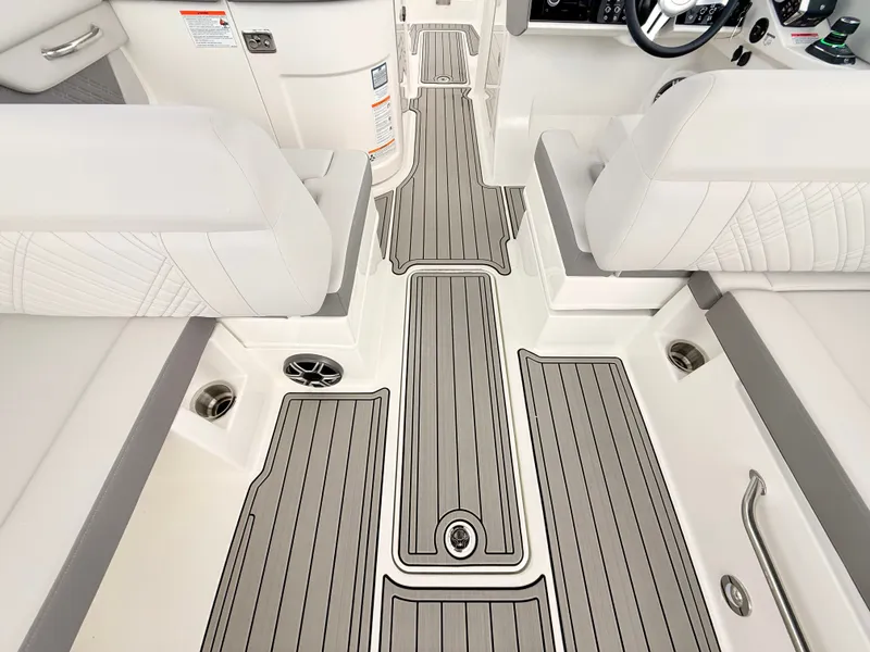 Slide: The Image of Interior of the 2027 Sea Ray SDX 290 Outboard with sleek white seating and gray flooring. - 49