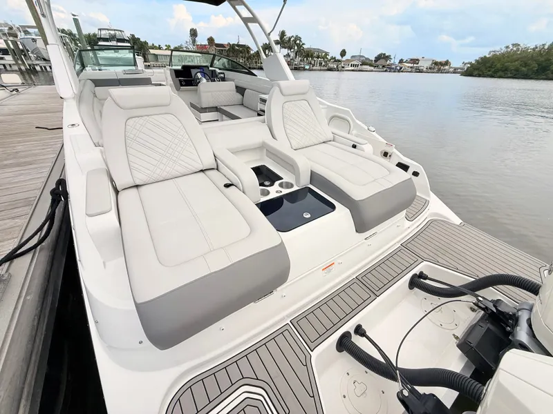 Slide: The Image of The image shows a 2027 Sea Ray SDX 290 Outboard boat with luxurious sun loungers at the stern. - 26