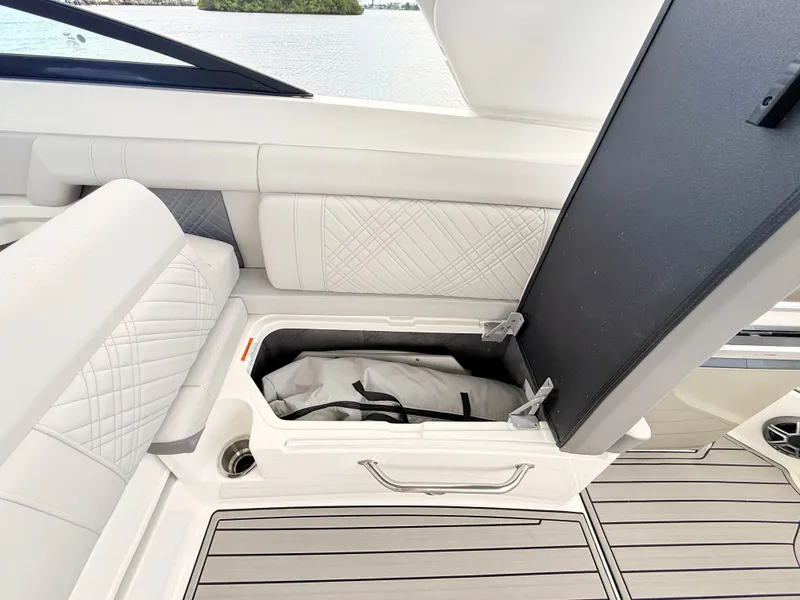 Slide: The Image of A storage compartment on a 2027 Sea Ray SDX 290 Outboard boat. - 47