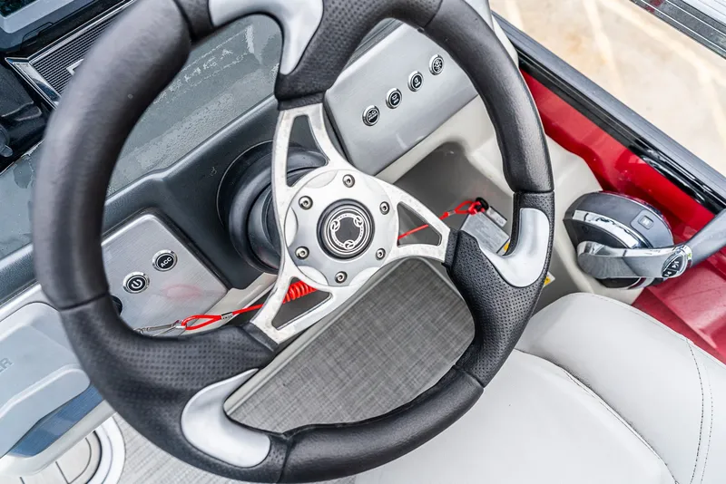 Slide: The Image of Close-up of a 2022 Regency R230 DL3 helm with a modern steering wheel. - 12