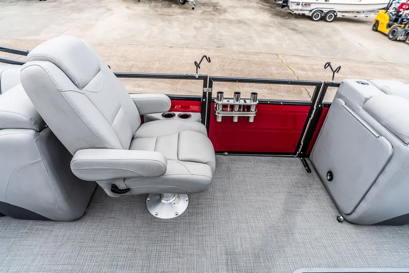 Slide: The Image of A luxurious seat on a boat with gray upholstery and cup holders. - 11