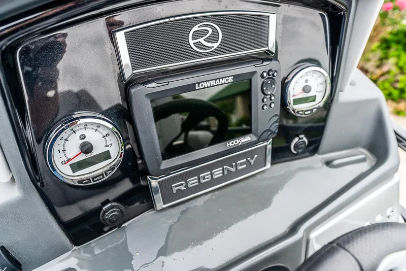 Slide: The Image of The dashboard of a 2022 Regency R230 DL3 with Lowrance display and gauges. - 13