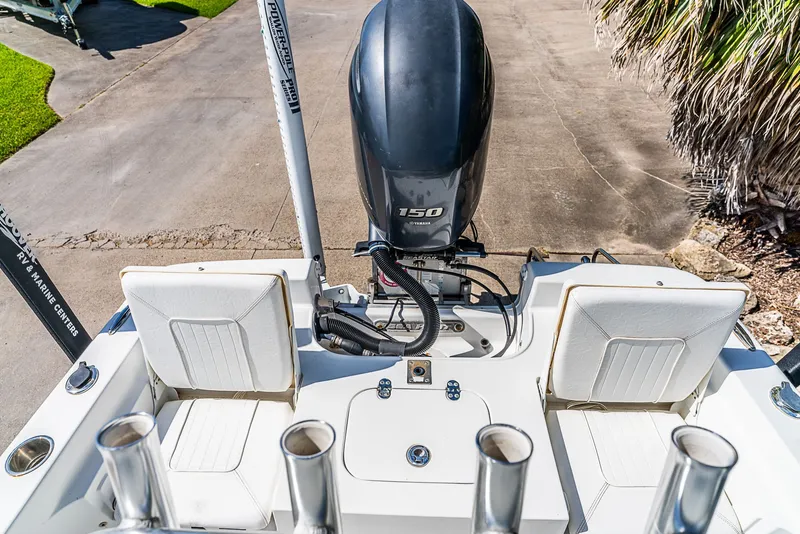 Slide: The Image of The image shows the stern of a 2016 Sea Hunt BX 20 BR boat with an outboard motor. - 9