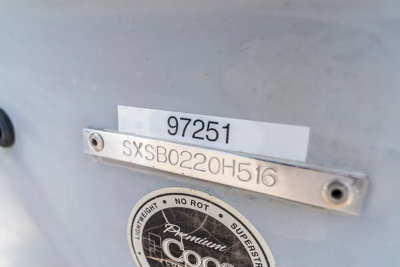 Slide: The Image of Close-up of a boat's identification plate with serial number and emblem. - 21