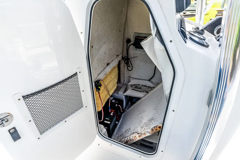 Slide: The Image of Interior of a 2016 Sea Hunt BX 20 BR with storage and electronics. - 13