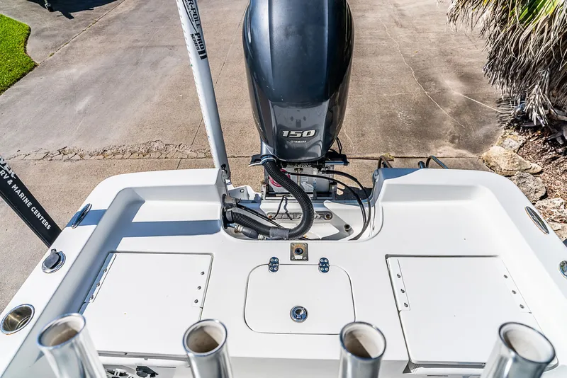 Slide: The Image of The image shows the stern of a 2016 Sea Hunt BX 20 BR boat with a 150 HP engine. - 8