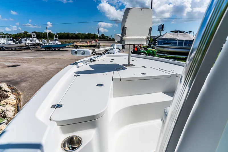 Slide: The Image of The image shows the deck of a 2016 Sea Hunt BX 20 BR boat at a marina. - 14