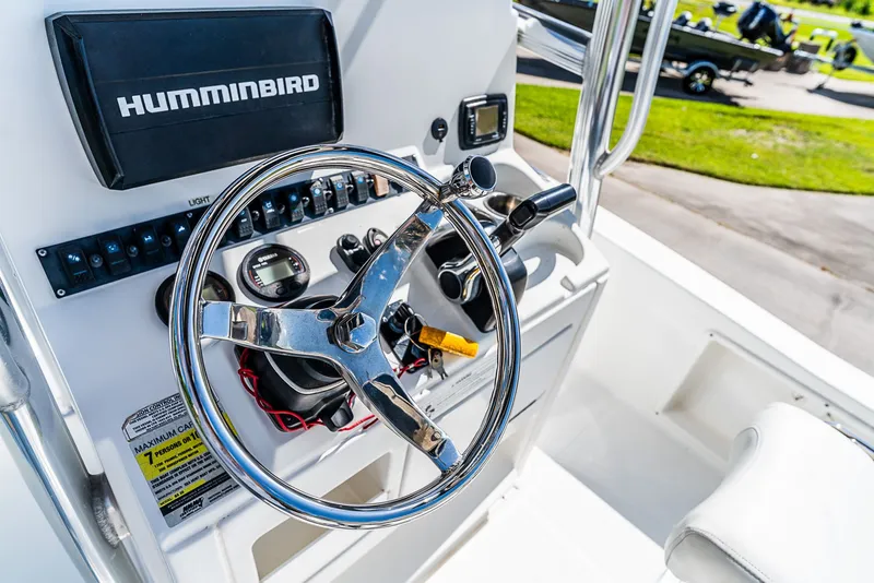 Slide: The Image of Helm of a Sea Hunt BX 20 BR boat with steering wheel and instruments. - 11