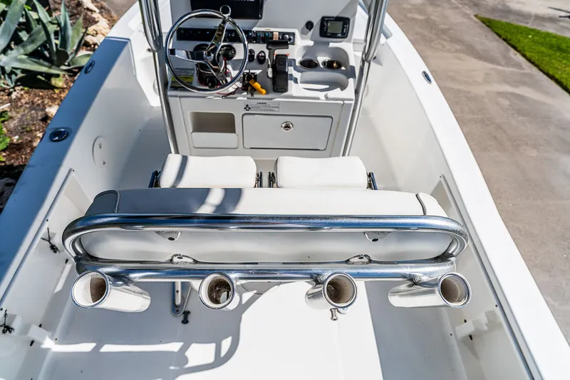 Slide: The Image of The image shows the cockpit of a 2016 Sea Hunt BX 20 BR boat with helm and rod holders. - 5
