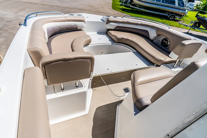 Slide: The Image of The image shows the cockpit of a 2016 Hurricane 21CC boat with beige upholstery. - 11