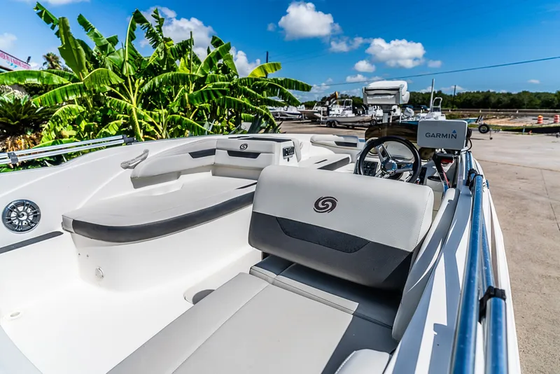 Slide: The Image of The image shows the cockpit of a 2020 Hurricane SS185 boat with white seating. - 6