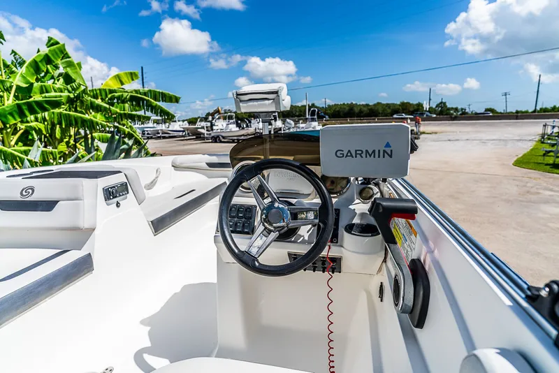 Slide: The Image of The image shows the helm of a 2020 Hurricane SS185 boat with Garmin navigation. - 8