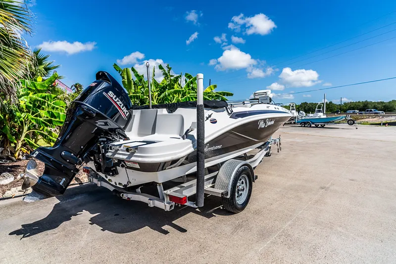 Slide: The Image of A 2020 Hurricane SS185 boat on a trailer in a sunny setting. - 3