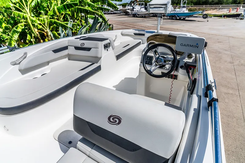 Slide: The Image of The image shows the cockpit of a 2020 Hurricane SS185 boat with a Garmin navigation system. - 7