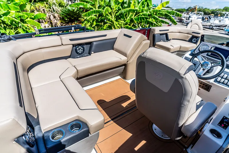 Slide: The Image of The image shows the interior of a 2022 Hurricane FD2260F boat with beige seating. - 8