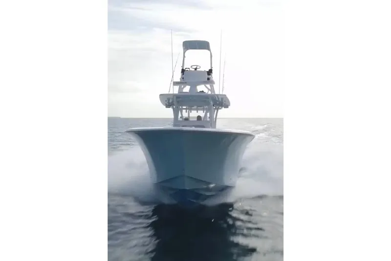 Slide: The Image of 2017 SeaHunter 35 Tournament boat cruising on open water. - 1