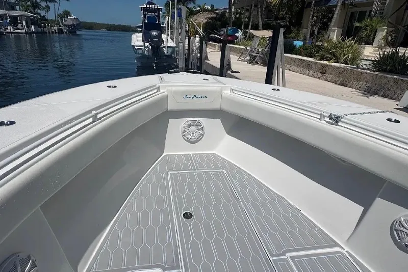 Slide: The Image of 2017 SeaHunter 35 Tournament boat interior with sleek design, docked by waterfront. - 12