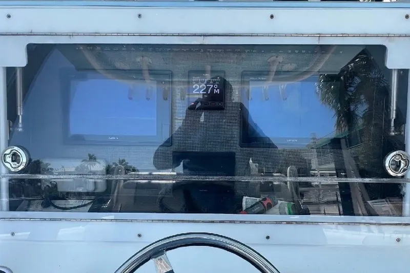 Slide: The Image of 2017 SeaHunter 35 Tournament dashboard with Garmin displays and steering wheel. - 18