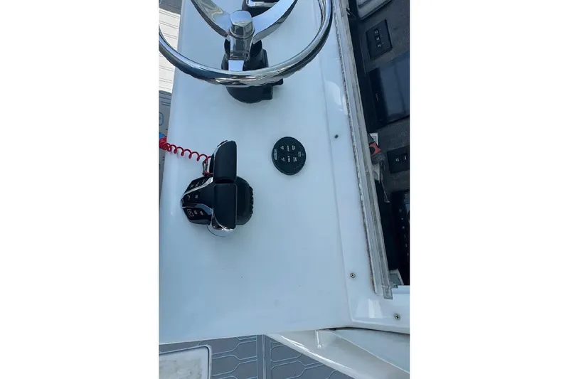 Slide: The Image of 2017 SeaHunter 35 Tournament boat helm with steering wheel and controls. - 19