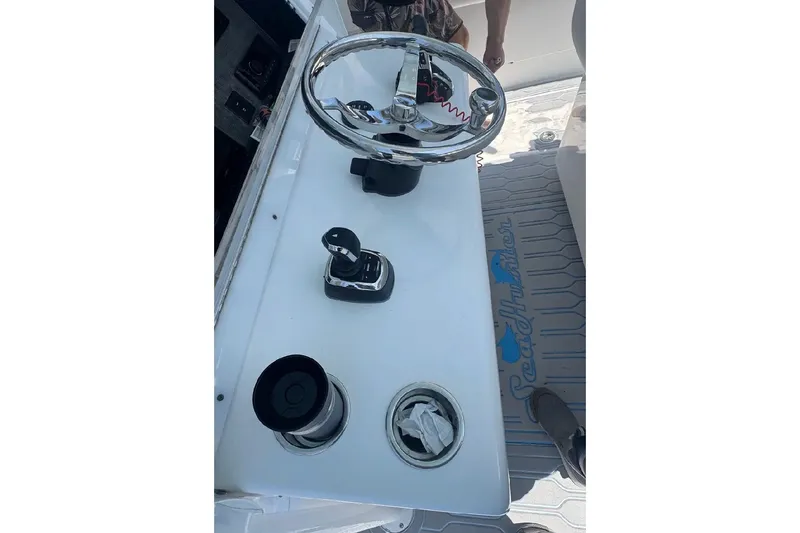 Slide: The Image of 2017 SeaHunter 35 Tournament boat helm with steering wheel and controls. - 20