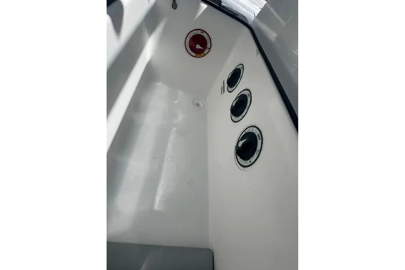 Slide: The Image of Interior view of a 2017 SeaHunter 35 Tournament boat showing control dials and a clean white surface. - 23