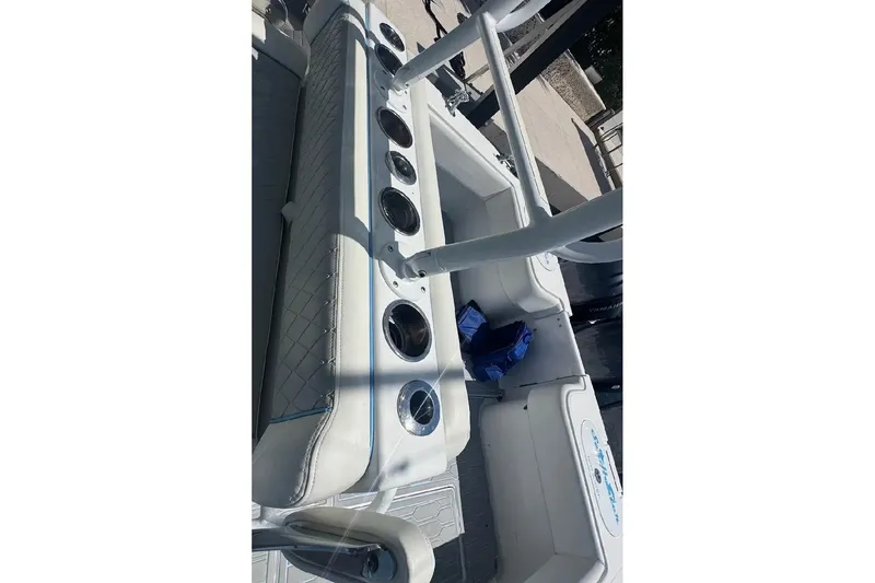 Slide: The Image of 2017 SeaHunter 35 Tournament boat interior with rod holders and seating. - 24