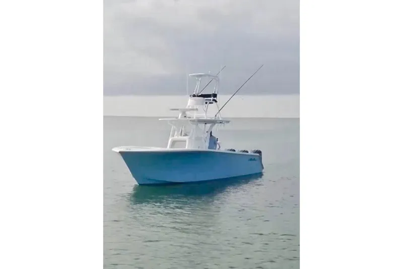 The Image of 2017 SeaHunter 35 Tournament boat on calm water under cloudy sky. - 0