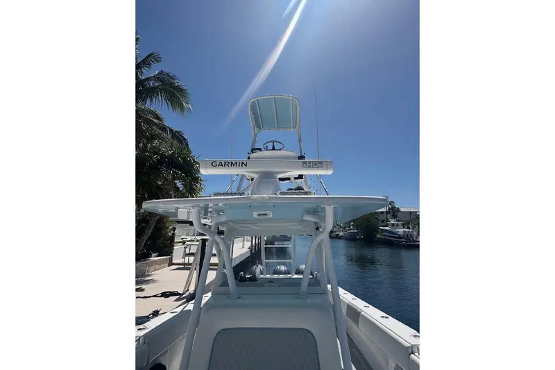 Slide: The Image of 2017 SeaHunter 35 Tournament boat with Garmin radar, docked under clear blue sky. - 11