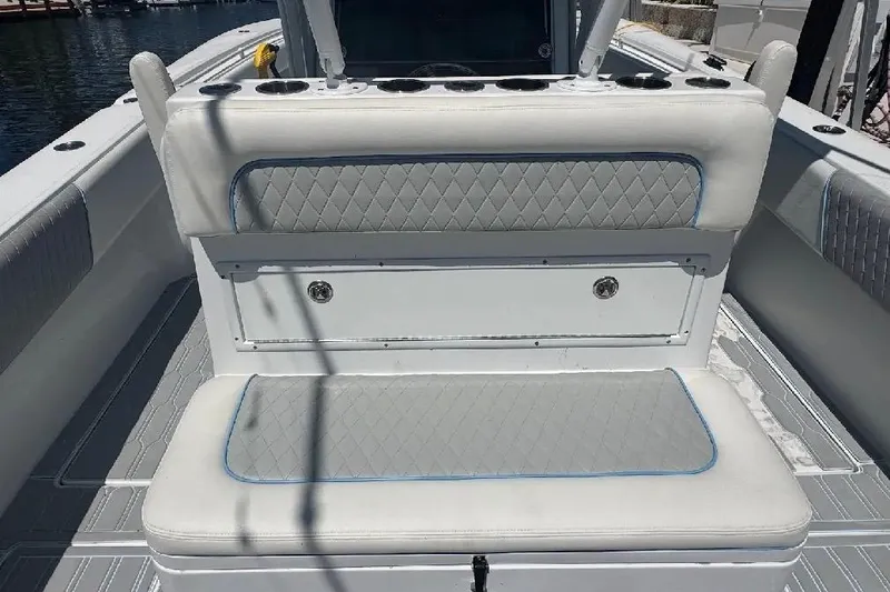 Slide: The Image of 2017 SeaHunter 35 Tournament boat interior with cushioned seating and storage. - 15