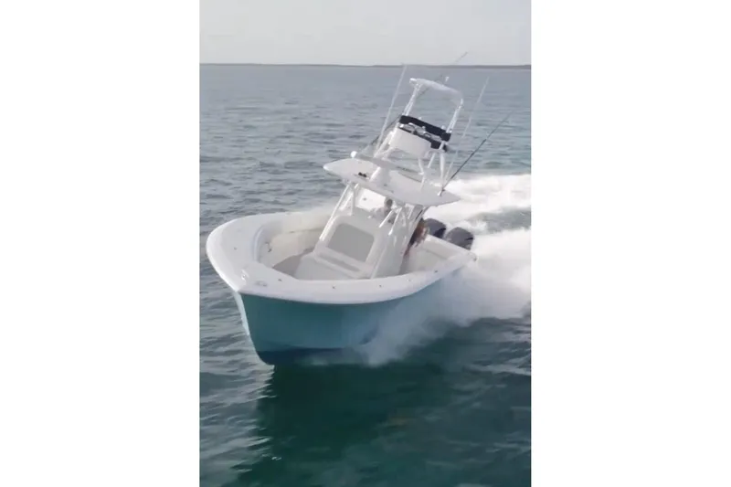 Slide: The Image of 2017 SeaHunter 35 Tournament boat cruising on open water. - 2