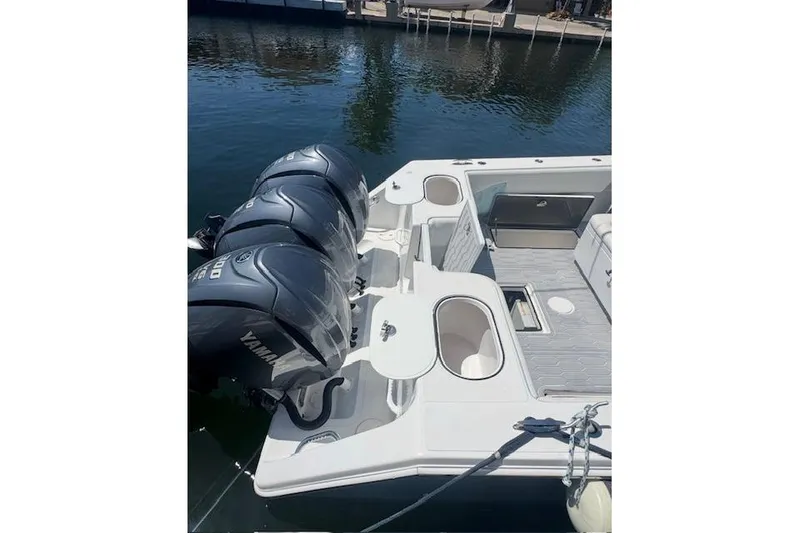 Slide: The Image of 2017 SeaHunter 35 Tournament boat with triple Yamaha outboard engines docked. - 22
