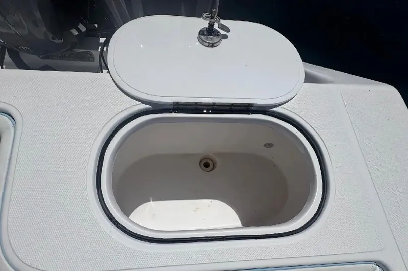 Slide: The Image of Open hatch on 2017 SeaHunter 35 Tournament boat, revealing storage compartment. - 26