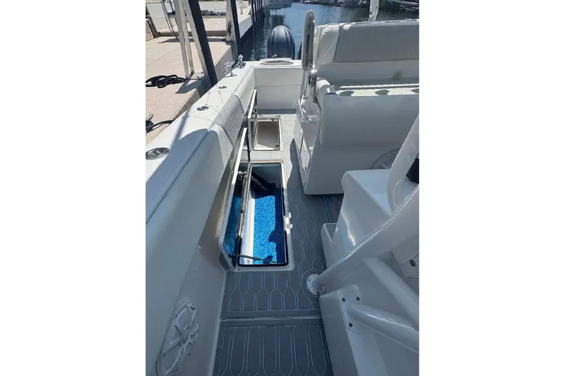 Slide: The Image of 2017 SeaHunter 35 Tournament boat interior with open storage compartments and seating. - 27