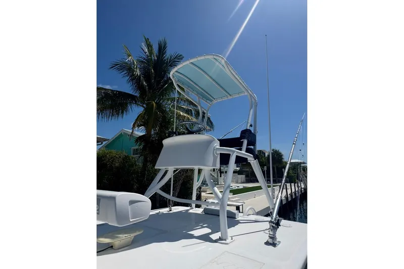 Slide: The Image of 2017 SeaHunter 35 Tournament boat with tower, docked under clear blue sky. - 29