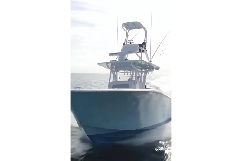 Slide: The Image of 2017 SeaHunter 35 Tournament boat cruising on open water, showcasing sleek design and performance. - 5