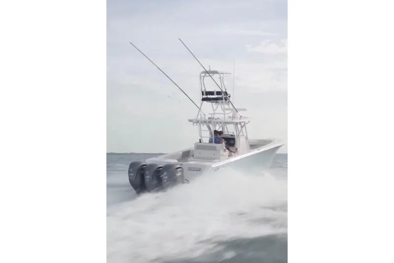 Slide: The Image of 2017 SeaHunter 35 Tournament boat speeding on open water, creating a wake. - 6