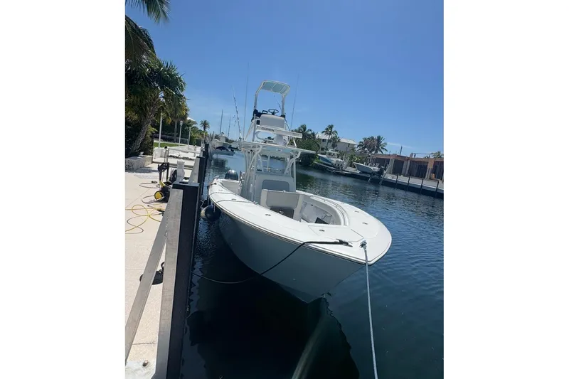 Slide: The Image of 2017 SeaHunter 35 Tournament boat docked in a sunny marina setting. - 9