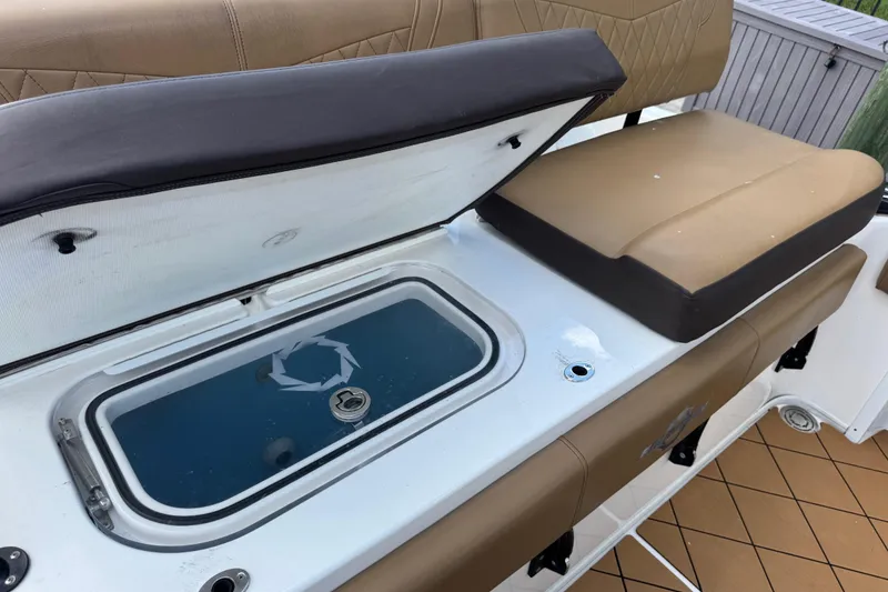 Slide: The Image of 2020 Fountain 38 Center Console boat seat with open storage compartment. - 11