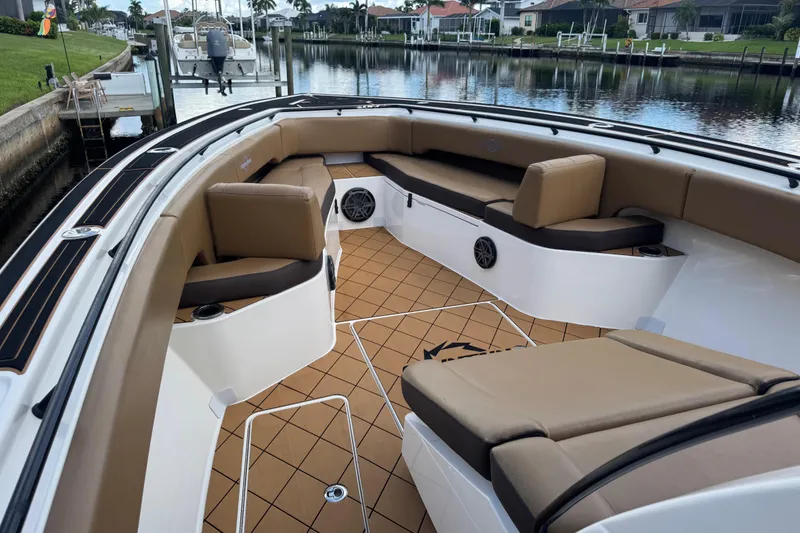 Slide: The Image of 2020 Fountain 38 Center Console boat interior with tan seating and sleek design. - 18