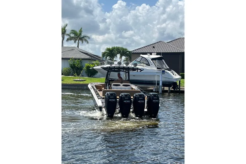 Slide: The Image of 2020 Fountain 38 Center Console boat with four engines on a sunny day. - 2